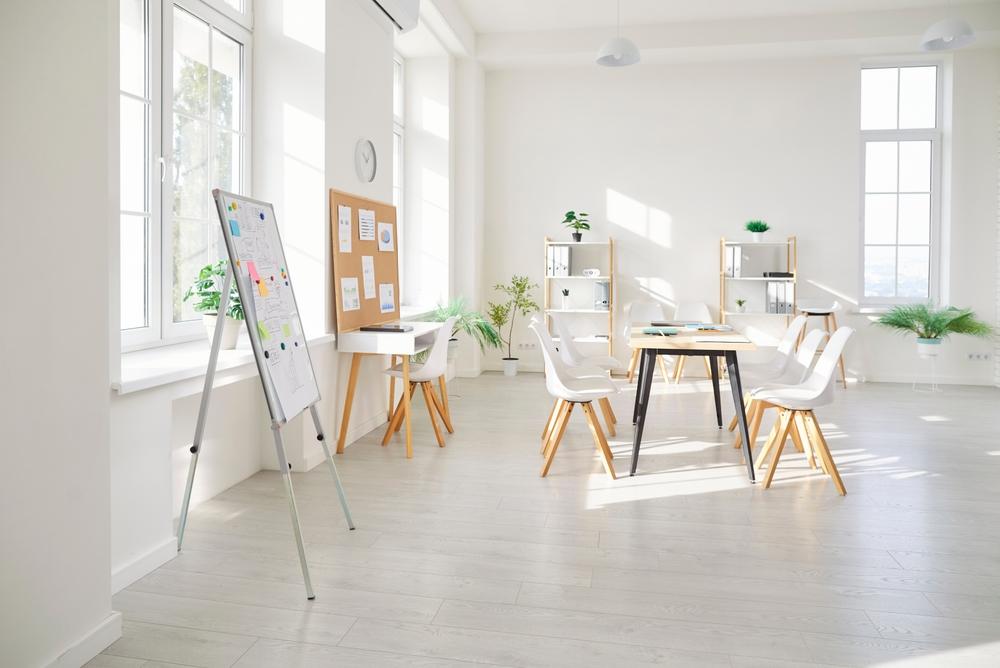Empty,White,Modern,Loft,Office,Space,With,Table,,Chairs,,Board,